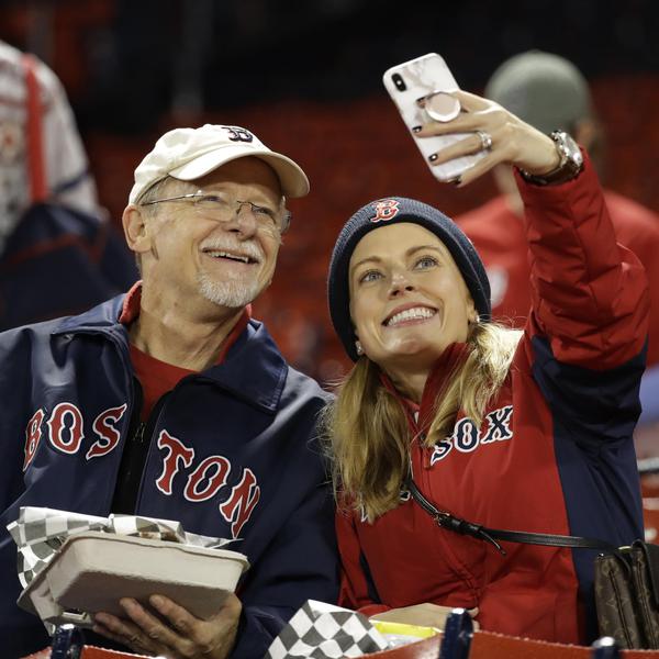 Boston fans take a selfie before Game 1 of the 2018 World Series between the Boston Red Sox and Los Angeles Dodgers at Fenway Park.