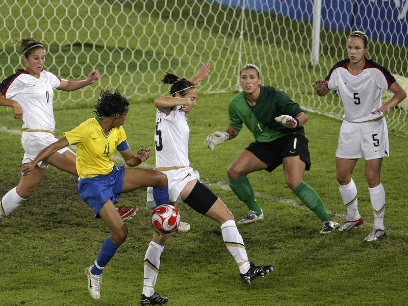 U.S. goalie Hope Solo, in the green jersey, defends the goal against Brazil during the women's soccer gold-medal game at the 2008 Summer Olympics in Beijing, China.