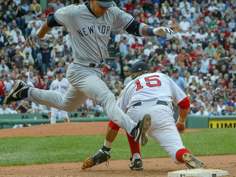 New York Yankees runner Alex Rodriguez, left, does not beat the throw to Boston Red Sox first baseman Kevin Millar during a 2004 game at Fenway Park in Boston.