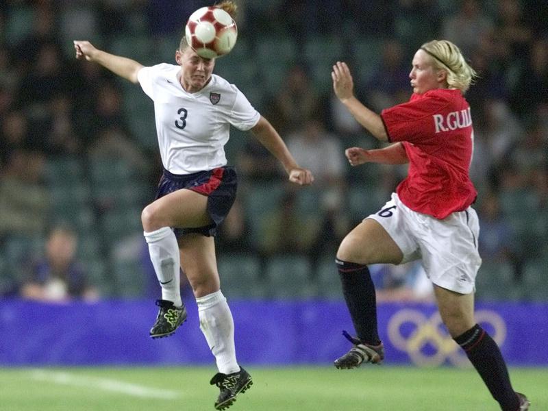 U.S. defender Christie Pearce, left, heads the ball against Norway during a soccer game at the 2000 Sydney Summer Olympics.