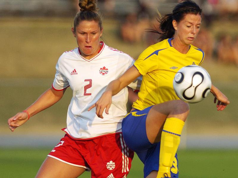 Sweden' forward Lotta Schelin, right, plays the ball away from Canada's Christine Latham during a 2006 soccer game in Blaine, Minnesota.