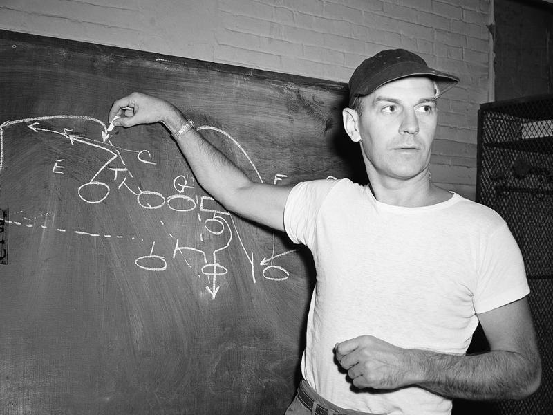 Cleveland Browns coach Paul Brown diagrams a pass play in 1947.